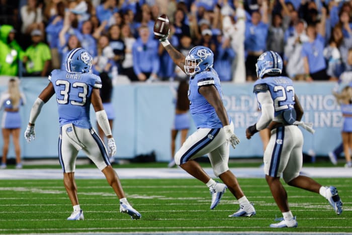 Oct 14, 2023; Chapel Hill, North Carolina, USA; North Carolina Tar Heels defensive lineman Myles Murphy (8) celebrates after recovering a fumble against the Miami Hurricanes in the second half at Kenan Memorial Stadium. Mandatory Credit: Nell Redmond-USA TODAY Sports